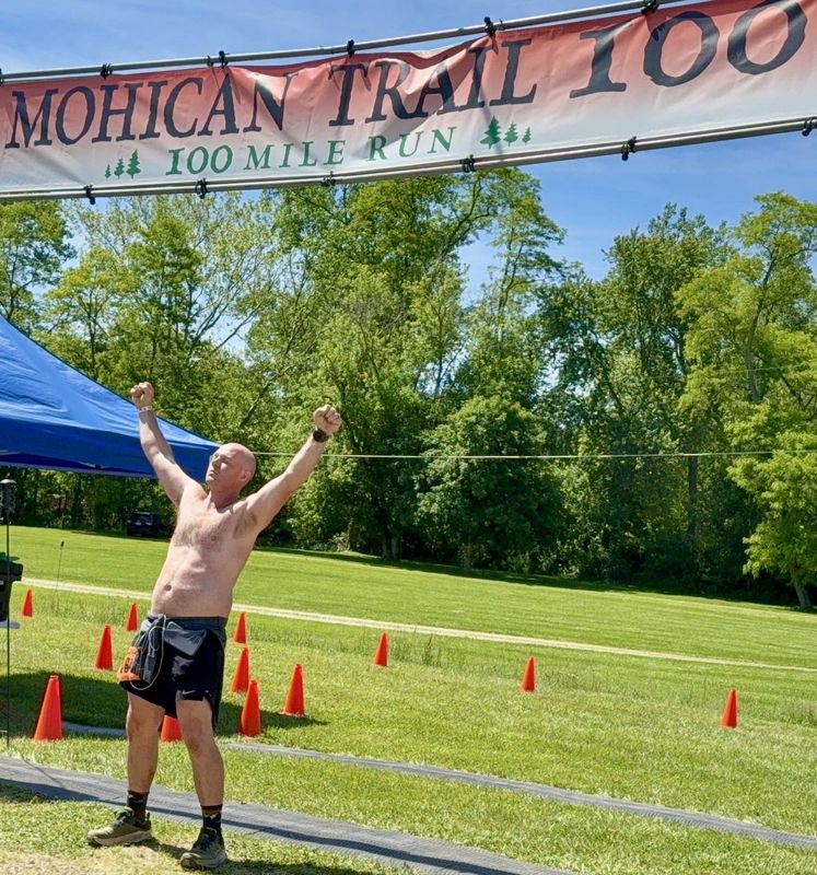Gabe Rainwater of Fresno at the finish line for the grueling Mohican 100-Mile Trail Run in Loundonville. Rainwater recently completed his 20th consecutive event, making him one of six and the youngest to accomplish the feat.