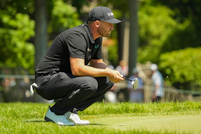 Wyndham Clark lines up a putt on the eighth green during the first round of the Memorial Tournament at Muirfield Village Golf Club on June 4, 2026.