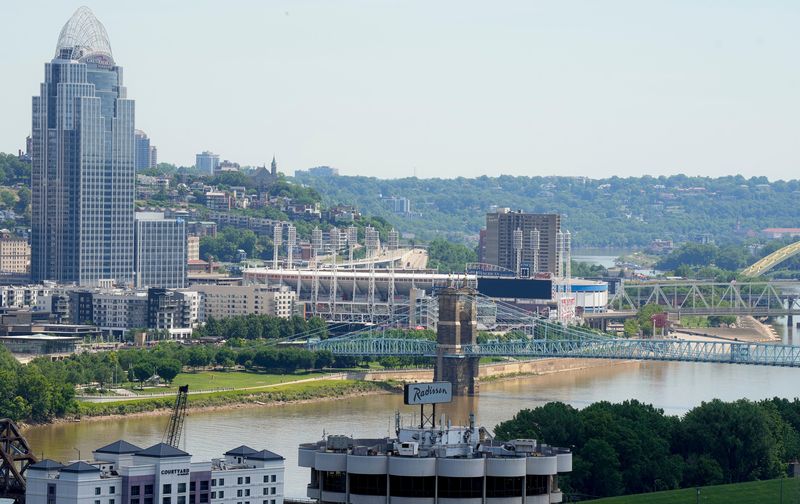 The Roebling Suspension Bridge spans the Ohio River toward downtown Cincinnati, with the Great American Tower at Queen City Square at left and Great American Ball Park, as seen from Devou Park in Covington, June 4, 2026.