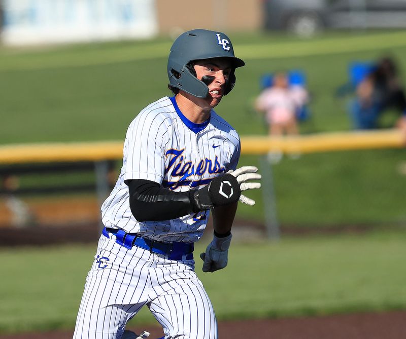 Lake Center Christian's Luke Heckert races to third base after hitting a triple during a win over Chippewa in a Division VI regional final at Louisville High School, Thursday, June 4, 2026.