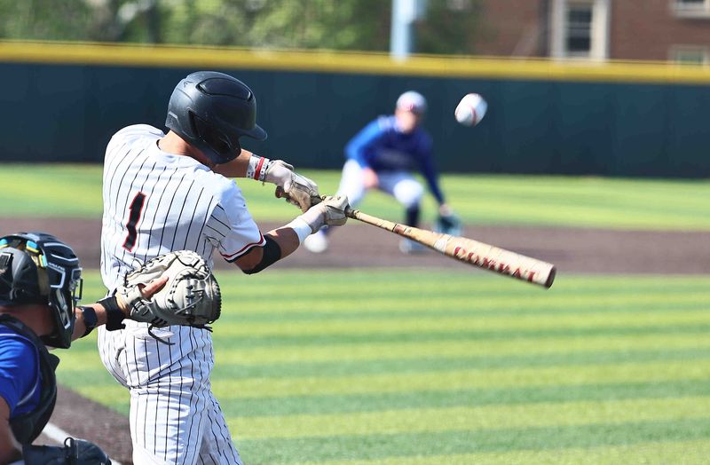 Oak Hills' Ethan Moeves (1) swings the bat during their 6-5 OHSAA DI regional final loss to St. Xavier Thursday, June 4, 2026.