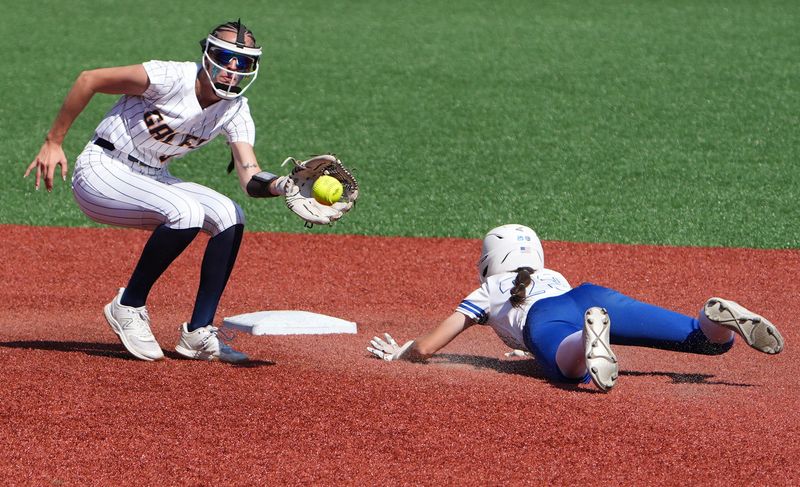 Lancaster's Hailey Rings takes the throw as Hilliard Bradley's Aubrey Allen slides safely into second base during the Division I final at Firestone Stadium in Akron, Ohio on June 4, 2026.