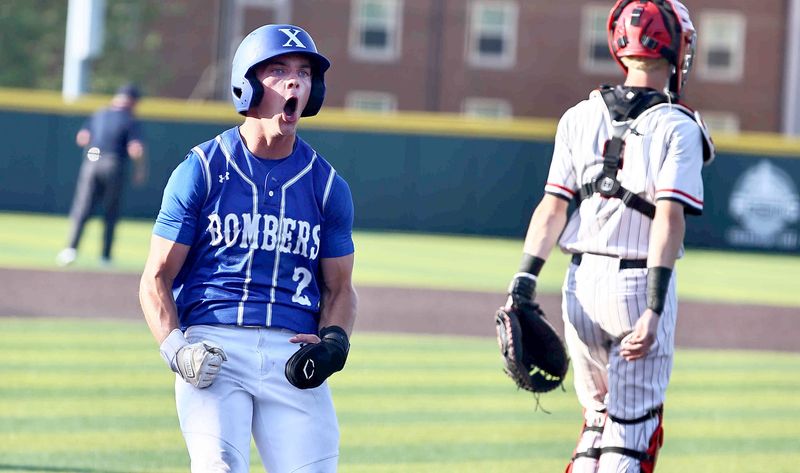 St. Xavier's Dillon Brus (2) reacts after crossing home plate during their 6-5 regional final win over Oak Hills Thursday, June 4, 2026.