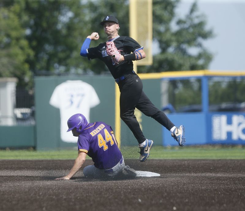 Campbell County sophomore Trip Mercurio (44) breaks up a potential double play during Campbell County's 6-1 win over LaRue County in the first round of the KHSAA state baseball tournament June 5, 2026, at Lexington's Legend Field.