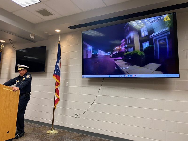 West Chester Township Police Chief Brian Rebholz plays bodycam footage during a press conference of officers entering an apartment on Zinnia Court and fatally shooting a man on June 4, 2026.