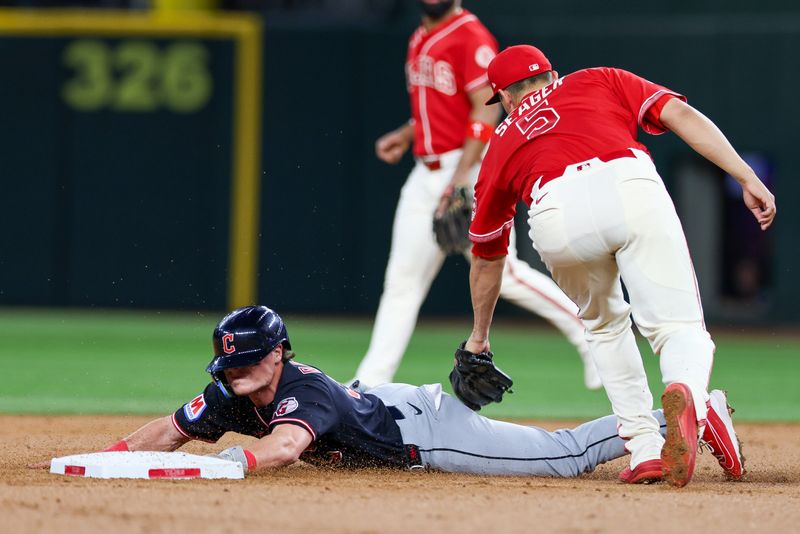 Jun 5, 2026; Arlington, Texas, USA; Cleveland Guardians second baseman Travis Bazzana (37) slides in under the tag of Texas Rangers Shortstop Corey Seager (5) at Globe Life Field. Mandatory Credit: Andrew Dieb-Imagn Images