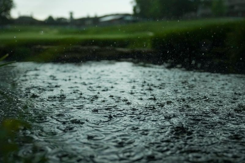 Patrons take cover during a weather delay during the third round of the Memorial Tournament at Muirfield Village Golf Club on June 6, 2026. Lightning and rain stopped play.