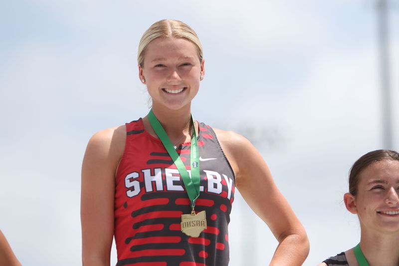 Shelby's Madison Henkel receives her Division III state long jump championship medal at the Ohio High School Athletic Association Jesse Owens State Track and Field Championships on Saturday, June 6, 2026 at Jesse Owens Memorial Stadium on the campus of The Ohio State University.