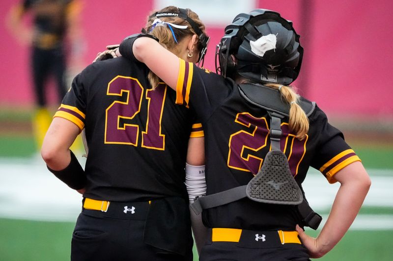 Walsh Jesuit’s Katie Lippencott (21) and Walsh Jesuit’s Brynn Mineard (20) share some encouraging words during an OHSAA DII state semifinal softball game against the Westerville Central Warhawks, June 6, 2026, at Firestone Stadium in Akron, Ohio.
