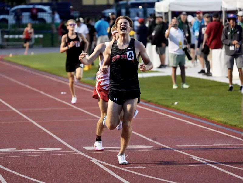 New Philadelphia’s Marcus Adelman celebrates as he crosses the finish line first in the Division II 3200-meter OHSAA Jesse Owens Track & Field State Championships in Columbus on June 6, 2026. Adelman completed the race in 8:58.66.