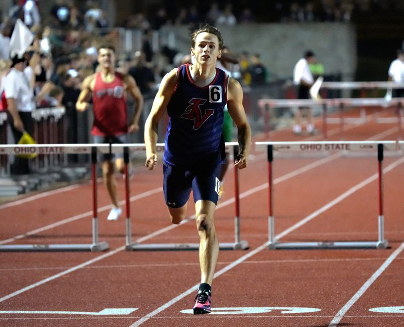 Indian Valley junior Carsen Hostetler crosses the finish line in first place to claim the title in the 300 hurdles at the Division III state track and field meet on Saturday, June 6, 2026, at Jesse Owens Memorial Stadium in Columbus. Hostetler, who clocked at :37.01, was also third in the 110 hurdles to become a two-time placer for the second straight year.