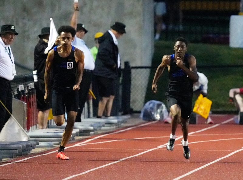 Ontario teammates Jermel Powell, left, and Tre Fowler run the 100 meters during the Division III state track and field meet on Saturday, June 6, 2026, at Ohio State's Jesse Owens Memorial Stadium in Columbus.