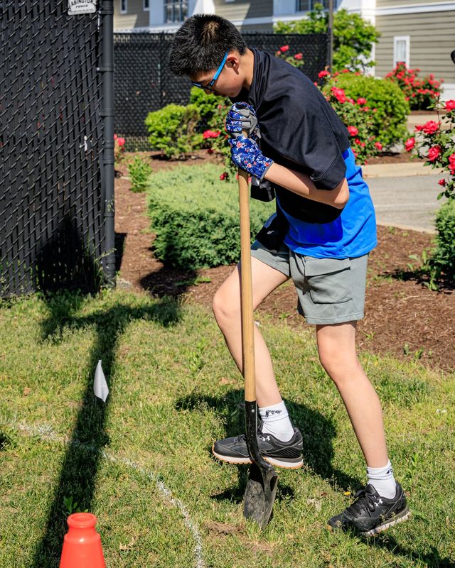 Central Middle School student Brandon Young, 13, puts his shovel in the ground to start work on the Quincy school's “Growing Seeds” landscaping project on Thursday, June 4, 2026.