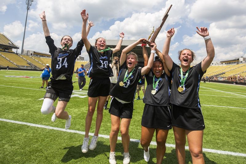 Olentangy Liberty players celebrate their third consecutive Division I state championship after defeating Upper Arlington 9-8 on June 7 at Historic Crew Stadium.