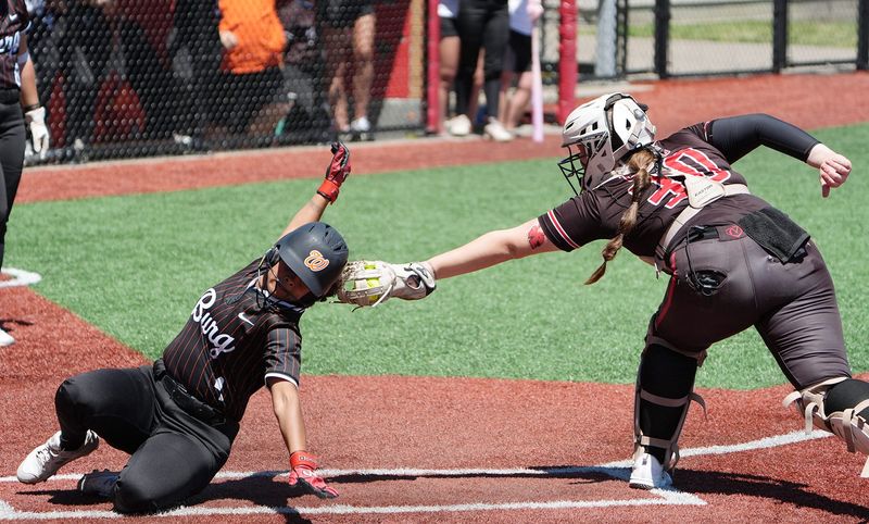 Wheelerburg's Ava Estep (4) slides safely home as Liberty Union's Emilyn Kanet (30) attempts to tag during the OHSAA DIV Softball Championship game at Firestone Stadium on June 7, 2026.