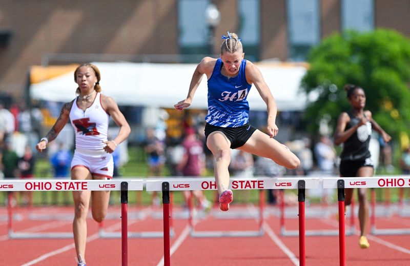 Hilliard Davidson’s Anna Wile nears the finish line and a state title in the 300-meter hurdles June 7 at Jesse Owens Memorial Stadium.