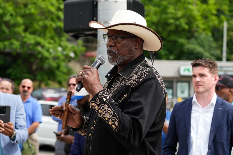 Marvin Butts speaks to the crowd who celebrated with him in Pendleton when Cincinnati officials renamed a portion of East 13th Street after him.