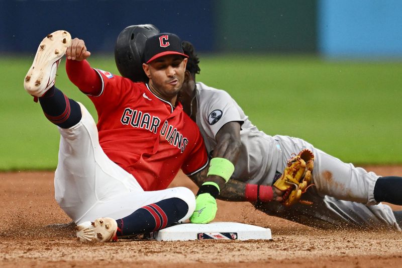 New York Yankees second baseman Jazz Chisholm Jr. is tagged out by Guardians shortstop Brayan Rocchio during a sixth-inning steal attempt, June 8, 2026, in Cleveland.