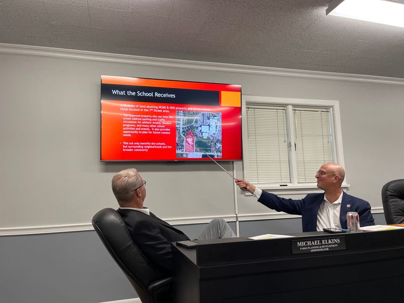 Jason Segedy, North Canton's deputy director of administration, points to the city's Dogwood Pool property that the city would turn over to the North Canton City School District in exchange for the Middle School and Orchard Hill Intermediate School sites. June 8, 2026