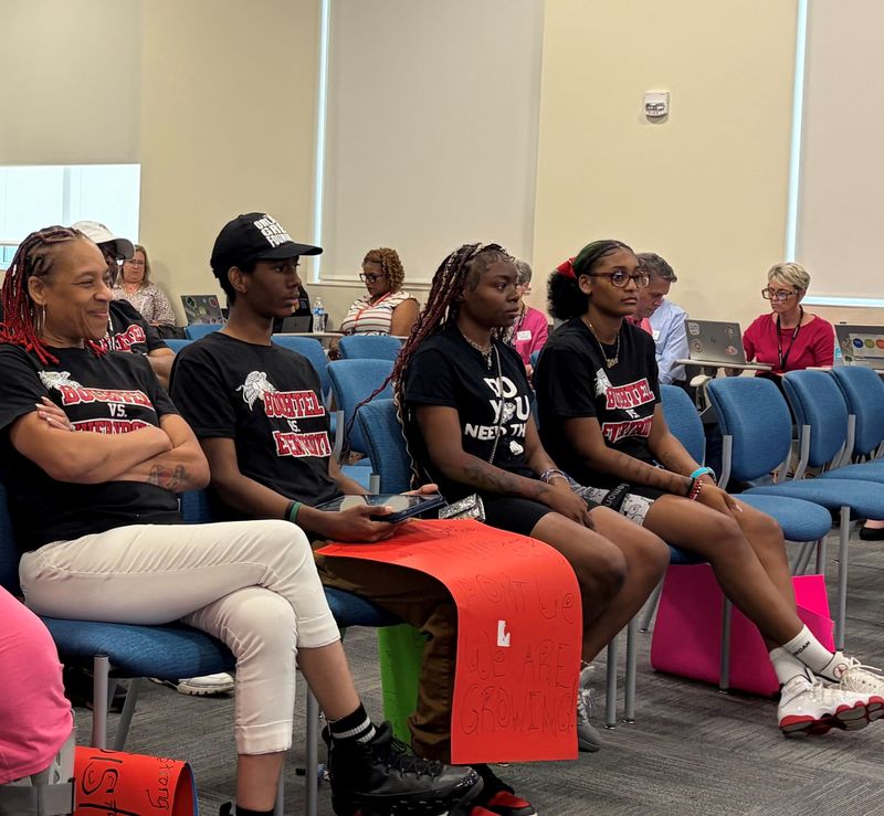 Lola Booker-Brewer, left, a secretary at Buchtel Community Learning Center, and recent Buchtel graduates Savion Wright, La’Joi Terrell and LaMyria Trammell were among the more than dozen people who attended the Akron school board meeting on June 8 to show support for Buchtel Campus Principal LaCresia Denson. They urged the school board to keep Denson as Buchtel's principal.