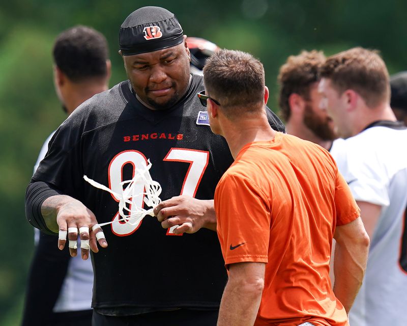 Cincinnati Bengals defensive tackle Dexter Lawrence II (97) unwraps his fingers during practice on Tuesday, June 9, 2026, at the Kettering Health Practice Fields in downtown Cincinnati.