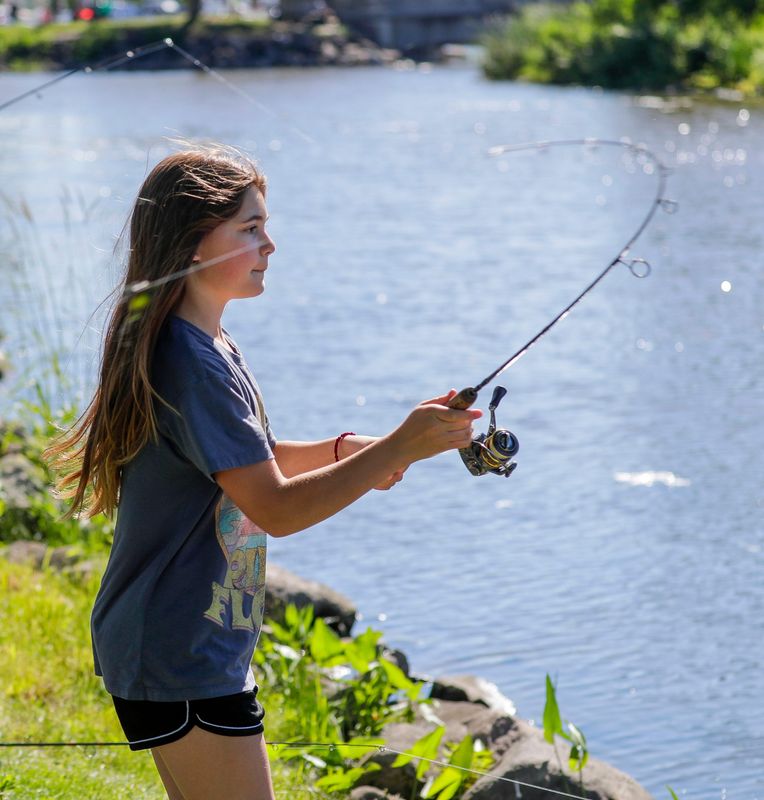 Scarlett Plonsky, 10, of Fond du Lac, casts her line while fishing at Walleye Weekend, Saturday, June 13, 2026, in Fond du Lac, Wis. The festival runs through Sunday.