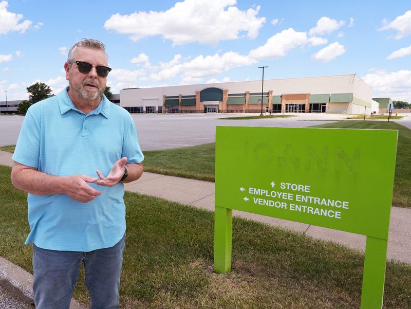 Philip Leiter, a Hudson community member, talks about the signature-gathering drive to change legislation addressing District 11, which outlines permitted types of developments at and around the former Joann headquarters in Hudson on June 16, 2026.