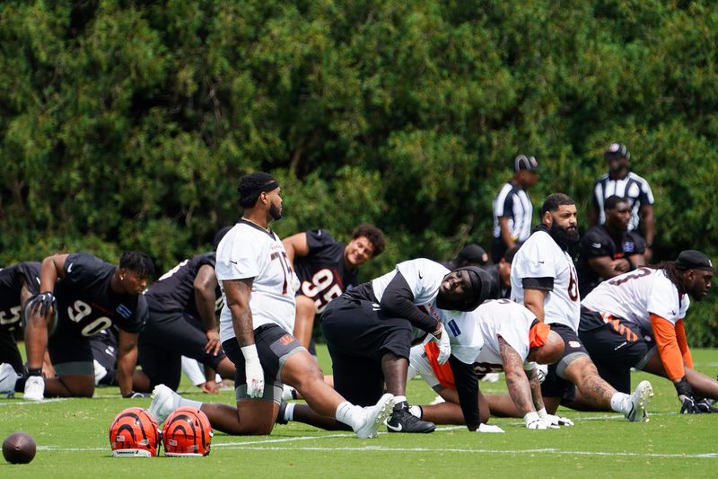 Cincinnati Bengals players warmup ahead of minicamp, Tuesday, June 16, 2026, at Kettering Health Practice Fields in downtown Cincinnati.
