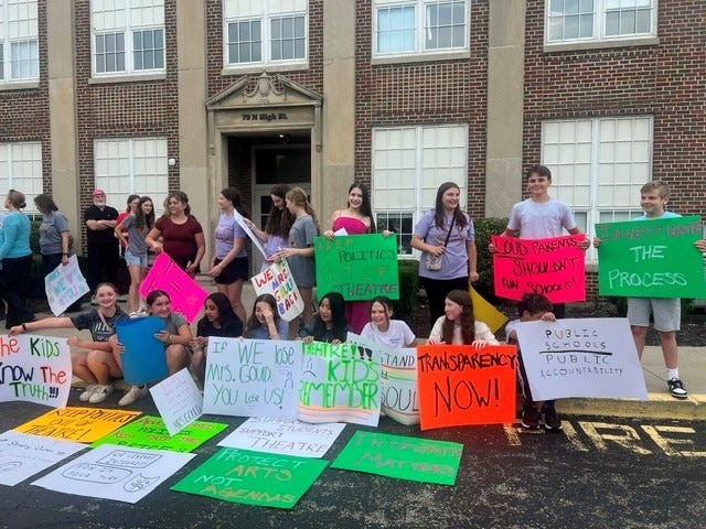 Dozens of parents and students rallied June 8 at the New Albany-Plain Local Schools board meeting to demand answers from the district after they say their beloved middle school theater director was forced to resign after pressure from a city council member.