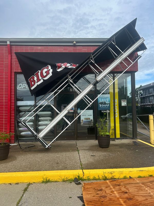 The front sign for Big Red's Appliances collapsed during a storm June 18, 2026.