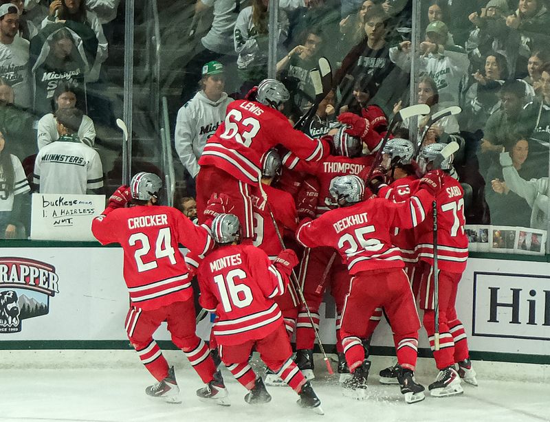 Ohio State celebrates the overtime goal against Michigan State Saturday, March 14, 2026 at Munn Arena.