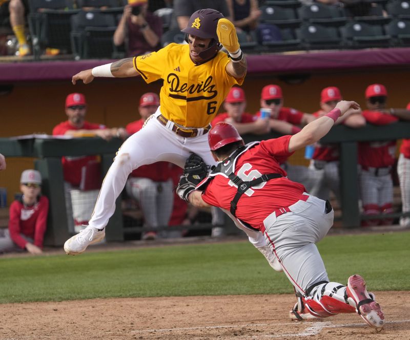 Arizona State infielder Nu'u Contrades (6) is tagged out by Ohio State catcher Mason Eckelman (16) at home during the fifth inning at Phoenix Municipal Stadium on Feb. 16, 2025.