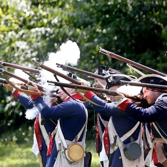 Members of the Brigade of the American Revolution, Northwest Department, fire weapons at a prior reenactment event at Fort Laurens near Bolivar.