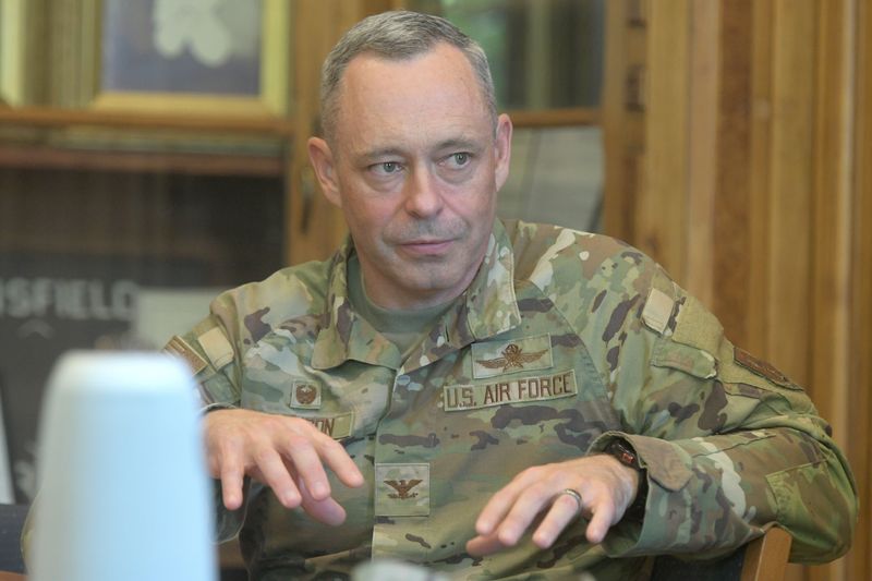 Col. Jack W. Johnson, 179th Cyberspace Wing commander, talks with local officials during a rountable at the Mansfield Chamber of Commerce office on Tuesday.