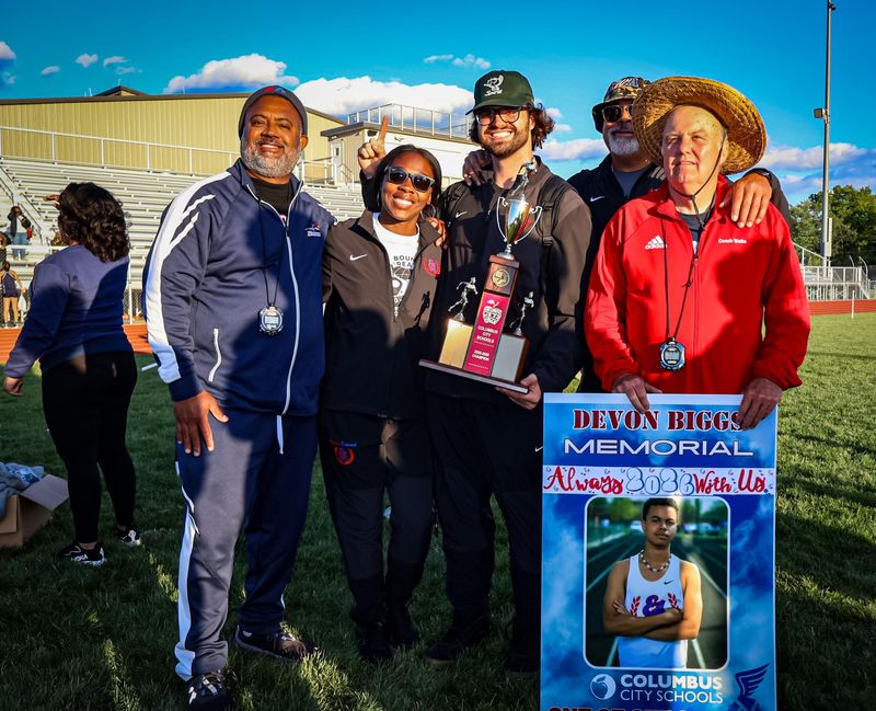 Eastmoor track and field coaches (from left) Jason Lewis, Ebonee Everett, Corben Miller, Anthony Thornton and Ernie Watts celebrate the Warriors' City League championship May 14 at Africentric. Watts died June 22.
