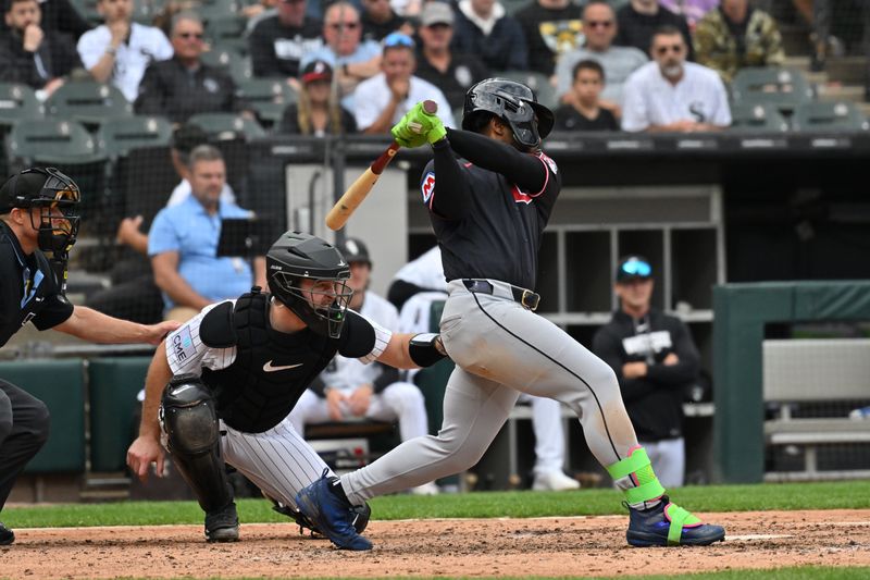 Cleveland Guardians' Kahlil Watson hits a two-run single against the Chicago White Sox on June 24, 2026, in Chicago, Illinois.