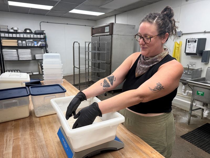 Fox + Mulberry bakery owner Beth Volpe works in the bakery's kitchen on June 22, 2026.
