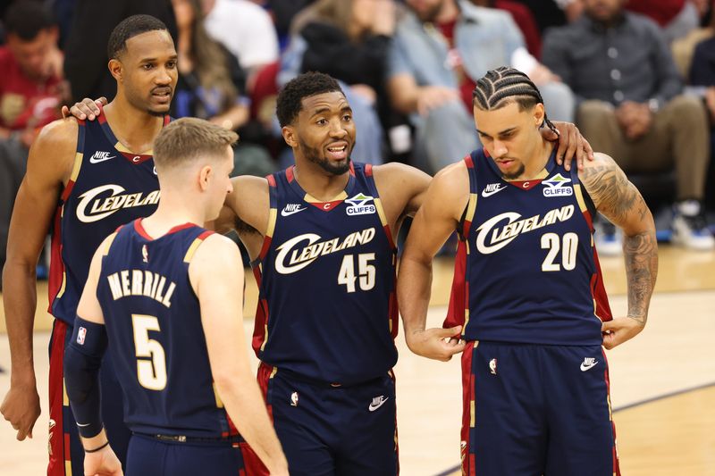 May 23, 2026; Cleveland, Ohio, USA; Cleveland Cavaliers guard Donovan Mitchell (45) huddles around teammates during the fourth quarter against the New York Knicks during game three of the eastern conference finals for the 2026 NBA playoffs at Rocket Arena.