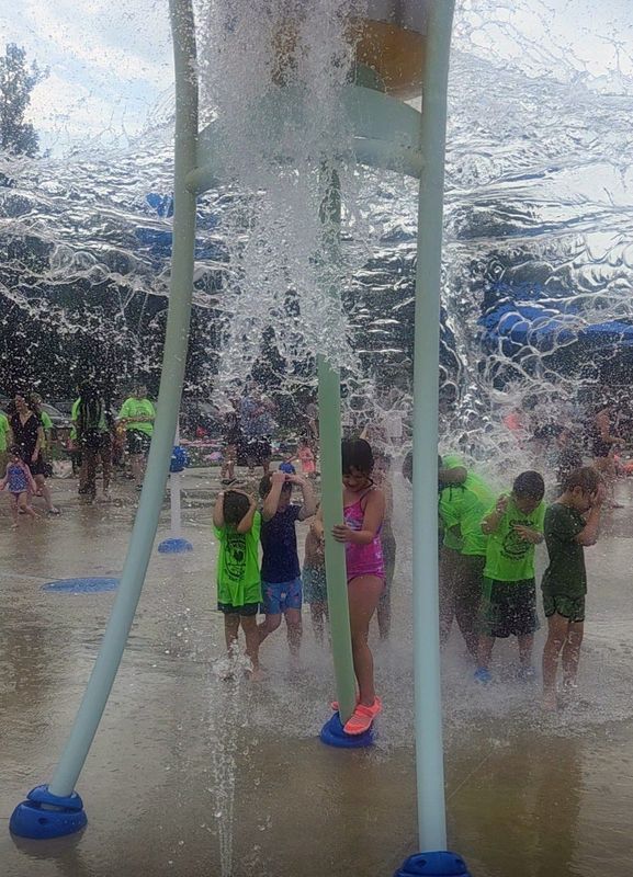 Eliza Branson, foreground, and other children brace themselves as a giant water bucket douses them on the morning of June 29 at the Gahanna Swimming Pool Splash Pad at 148 Parkland Drive. Temperatures were already past 80 degrees, a forewarning of the expected 98-degree high this week with a "feels like" temperature above 100 degrees.