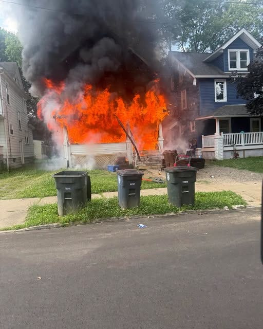 A fire Monday on Hazel Street damaged two Akron homes and injured a firefighter.