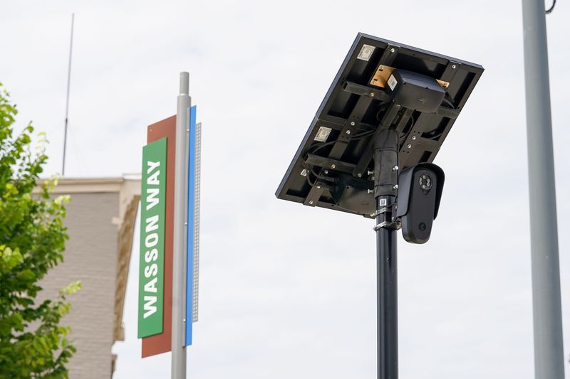 A Flock camera posted on the intersection of Wasson Way and Montgomery Road, Thursday, June 25, 2026, in Evanston. Numerous of Flock cameras are being posted throughout Cincinnati and read the license plates of drivers passing by.