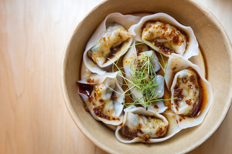 An order of Chicken and Basil Wontons with Spicy Chili at Yee Mama in Findlay Market in the Over-the-Rhine neighborhood of Cincinnati on Tuesday, June 30, 2026.