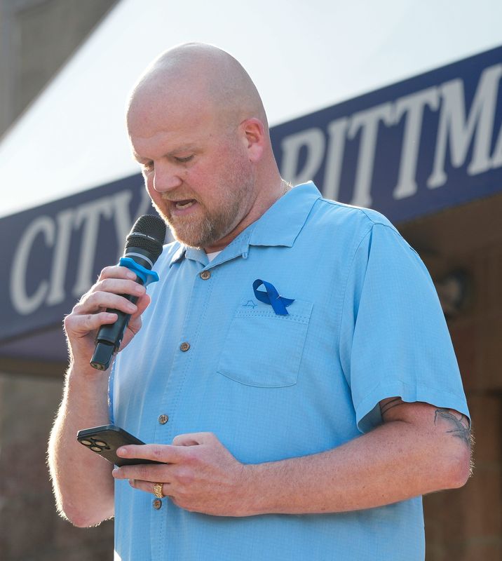 Rittman Mayor Charles Rudy Arnold delivers remarks during a candlelight vigil held in remembrance of Rittman Police Sgt. Scott Ries, July 6, 2026, in Rittman, Ohio.