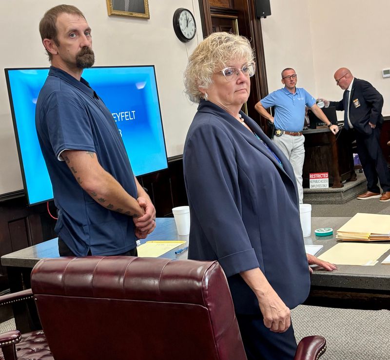 Bradley Shaneyfelt and attorney Marie Wheeler stand as the jury enters the Coshocton County Common Please Court. Shaneyfelt has been charged with two counts of rape and one county of sexual battery.
