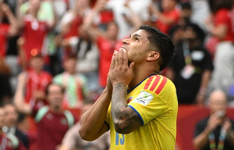 Colombia's Cucho Hernandez reacts after missing his attempt during a penalty shootout against Switzerland.