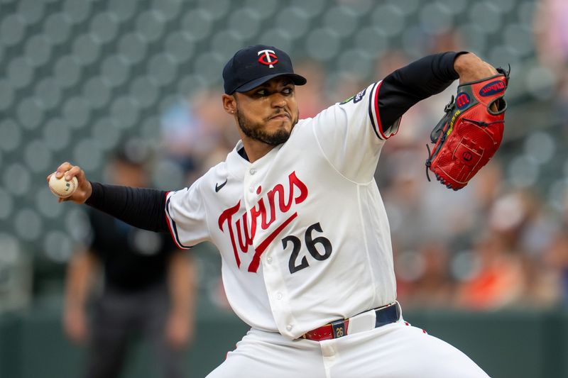 Minnesota Twins starting pitcher Taj Bradley delivers a first-inning pitch against the Cleveland Guardians, July 7, 2026, in Minneapolis.