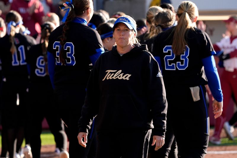 Tulsa coach Crissy Strimple walks off the field after a college softball game between the University of Oklahoma (OU) and Tulsa at Love's Field in Norman, Okla., Saturday, Feb. 22, 2025.