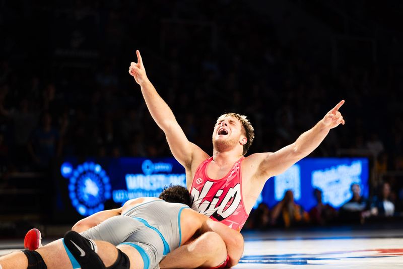 Brecksville's Zack Aquila celebrates his 175-pound national freestyle title over California's Mario Carini in Fargo, ND on July 12, 2026