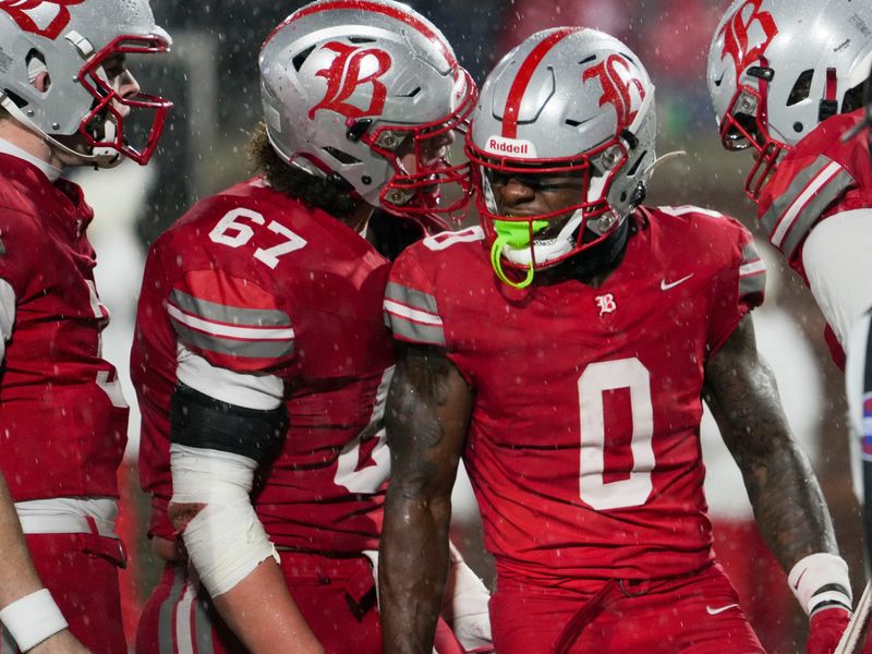 Teammates celebrate with Baylor's David Gabriel Georges (0) as he scores a touchdown during the Division II-AAA Championship match between Baylor versus. Brentwood Academy in Finley Stadium, Chattanooga, Tenn., on Thursday, Dec. 4, 2025.