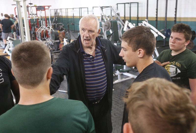 Former Kent State football player and coach Jim Corrigall works with St. Vincent-St. Mary football players during their summer conditioning program on Tuesday, June 25, 2019.